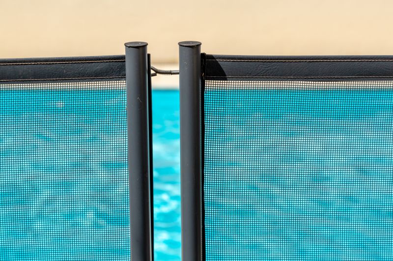 Mesh Fence Bordering Pool Deck